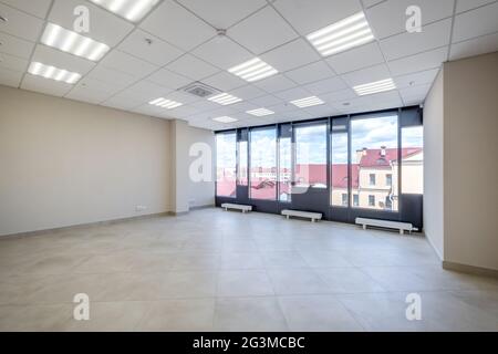 Modern white empty room interior with columns and panoramic windows.  room for office or store Stock Photo