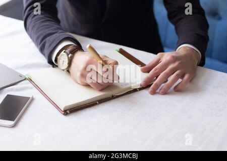 Businessman making notes on the paper Stock Photo