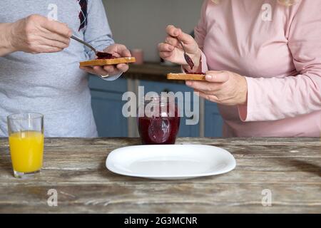 Elderly couple having breakfast. Stock Photo