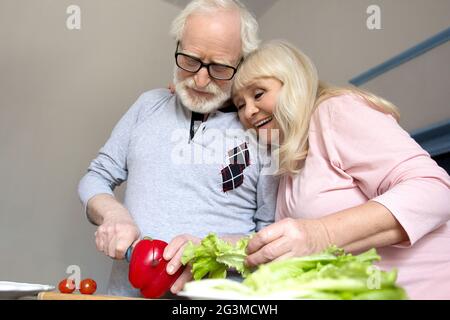 Senior couple cooking together. Stock Photo