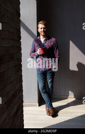 Attractive guy drinking coffee. Stock Photo