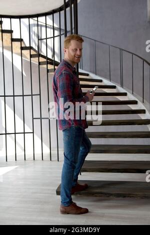 Young man walking up stairs. Stock Photo