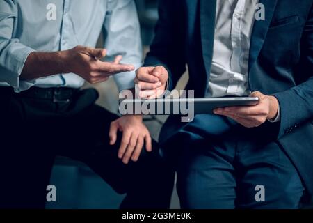 Close up of two businessmen with tablet. Stock Photo