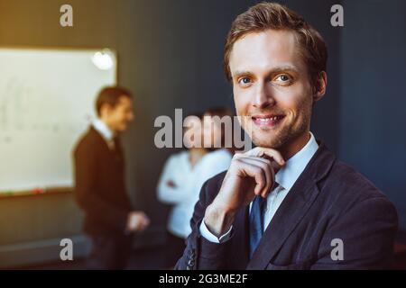 Smartly dressed businessman in office Stock Photo