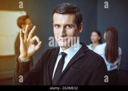 Smartly dressed businessman in office Stock Photo