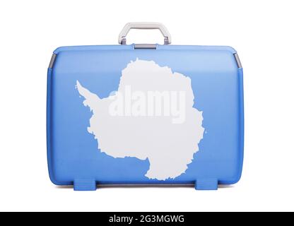 Used plastic suitcase with stains and scratches Stock Photo