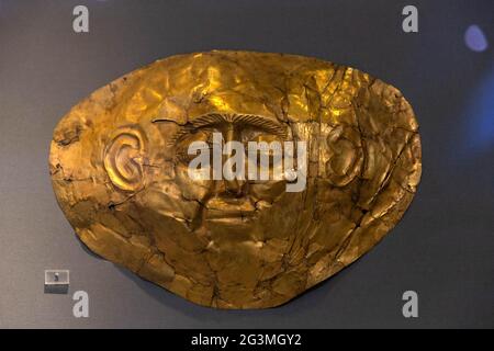 (210617) -- ATHENS, June 17, 2021 (Xinhua) -- Photo taken on June 7, 2021 shows a gold death-mask of the Mycenaean Civilization, made of sheet metal with repousse details, at the National Archaeological Museum, in Athens, Greece. The imposing golden mask of Agamemnon welcomes visitors at the National Archaeological Museum here, standing out among other finds from the royal cemetery of the ancient city of Mycenae on the Peloponnese peninsula dating back to the 16th century BC. TO GO WITH 'Interview: Ancient Greek golden death-masks of Mycenae still engulfed in mystery, says archaeologist' (Xi Stock Photo