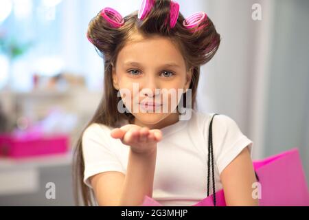 Cute little girl blowing kiss. Stock Photo