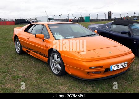 Three-quarters front view of an 1996, Orange, Lotus Esprit GT3, on display, at the 2017 Silverstone Classic Stock Photo