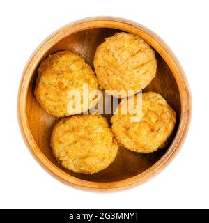 Pre-fried vegan falafel balls, in a wooden bowl. Group of ball shaped fritters, based on chickpeas and rice, a traditional Middle Eastern food. Stock Photo