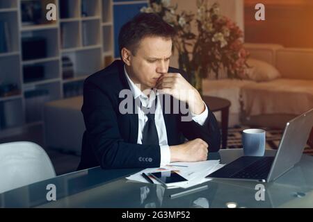 Handsome businessman working from home Stock Photo
