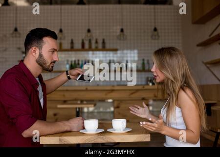 Quarrel between loved young man and woman. Stock Photo
