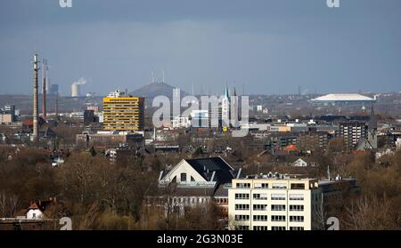 '11.03.2021, Gelsenkirchen, North Rhine-Westphalia, Germany - View of the city of Gelsenkirchen with the Old Town Church, Schalke Stadium at the back Stock Photo