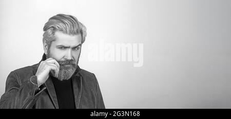 Attractive young man with leather jacket looking at camera. Stock Photo