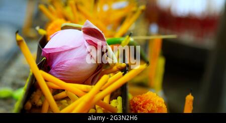close up of lotus flower and holly candle in buddhist temple Stock Photo
