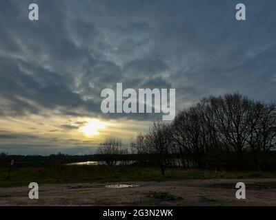 evening sky over the fields overcast with thunderclouds sunset. High quality photo Stock Photo