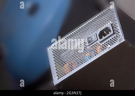 Cleaning the computer power supply from dust with a brush. Stock Photo
