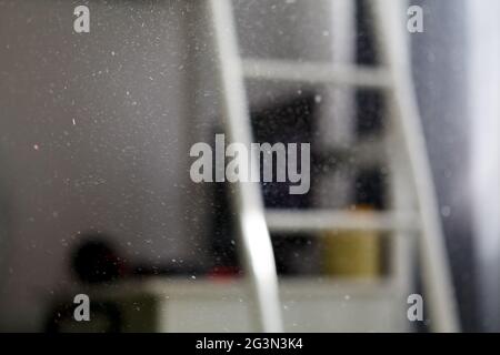Dust in the room, in the sunlight from the window, in the. Stock Photo