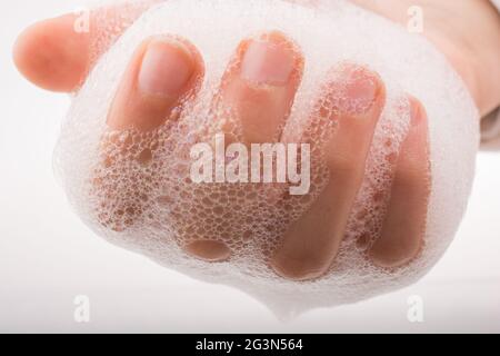 Child washing hands  in foam Stock Photo