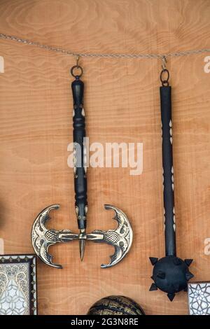 War axe and a mace on a wooden background Stock Photo