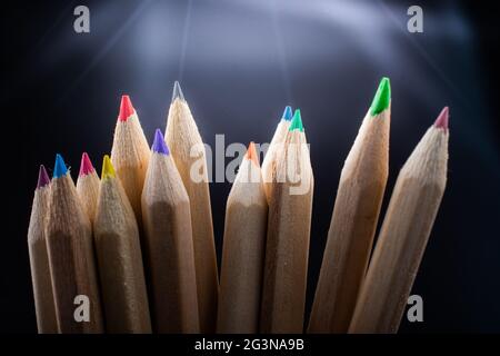 Hand holding colored pencils for creative idea and concept. Stock Photo