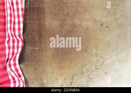 Red checkered tablecloth on grunge background Stock Photo