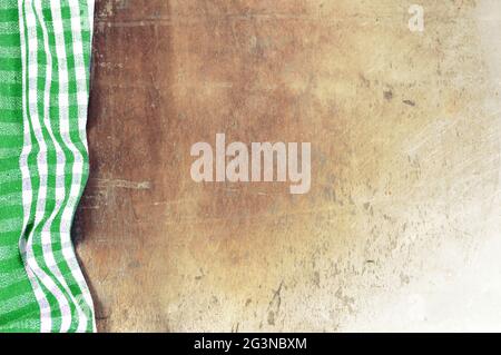 Green checkered tablecloth on grunge background Stock Photo