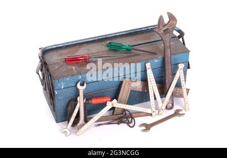 Old toolbox filled with vintage tools Stock Photo