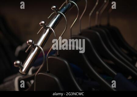 Clothes on hangers in shop for sale Stock Photo