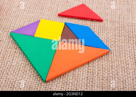 Pieces of a square tangram puzzle Stock Photo
