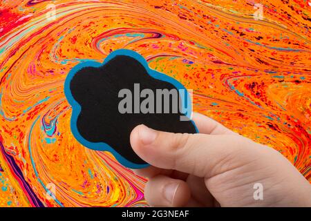 Hand holding a speech bubble icon in hand Stock Photo