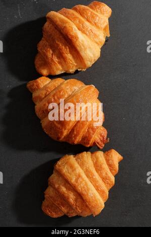 Croissant isolated in  wihite background with sunny light Stock Photo