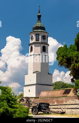 Historic Clock tower (Sahat kula) of the Belgrade Fortress Kalemegdan, with displayed old artillery gun Stock Photo