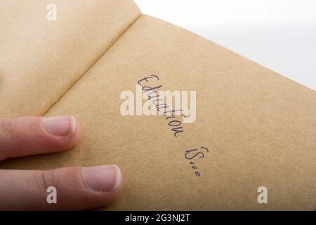Hand pointing on a notebook Stock Photo