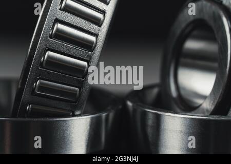 Two new car bearings on a black background macro photo Stock Photo