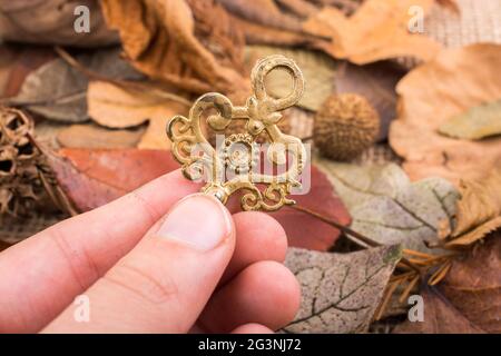 Hand holding a retro styled key Stock Photo