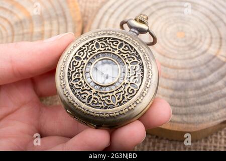 Mechanical pocket watch on wood pieces Stock Photo