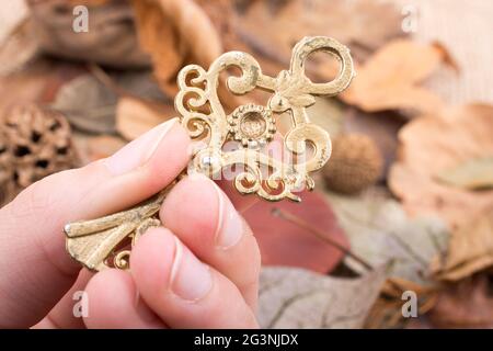 Hand holding a retro styled key Stock Photo