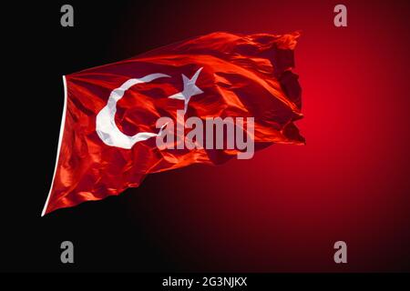 Turkish national flag with white star and moon in view Stock Photo