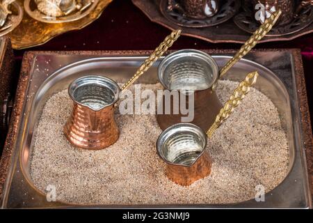 Turkish coffee pots made of metal in a traditional style Stock Photo