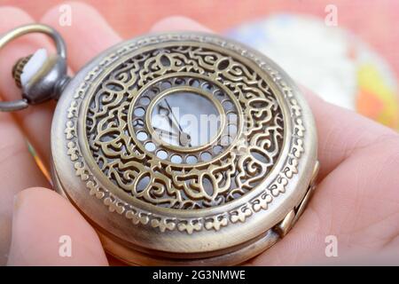 Pocket watch in hand Stock Photo