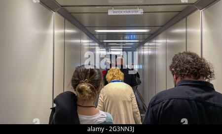 Sanford, FL USA - May 13, 2021:   People waiting in the jetway to board an Allegiant airplane at the Sanford International Airport in Sanford, Florida Stock Photo