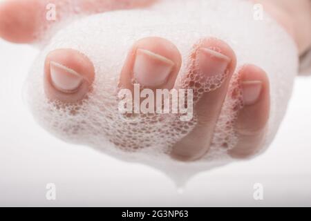 Child washing hands  in foam Stock Photo