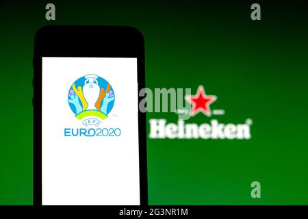 June 15, 2021, Spain: In this photo illustration a UEFA Euro 2020 logo seen displayed on a smartphone with a Heineken logo in the background. (Credit Image: © Thiago Prudencio/SOPA Images via ZUMA Wire) Stock Photo