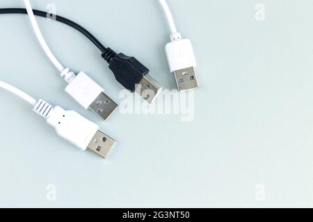 Different charging or data transmission plugs adapter from USB on gray background top view Stock Photo