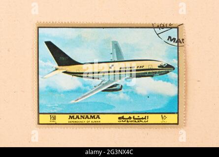 UNITED ARAB EMIRATES - CIRCA 1980: A stamp printed in the UAE shows an old airplane (Boeing 737), circa 1980 Stock Photo