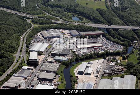 aerial view of BCA (British Car Auctions) and Clipper Logistics at J25 M62. Wakefield Industrial Estate, Armytage Road, Brighouse, West Yorkshire Stock Photo