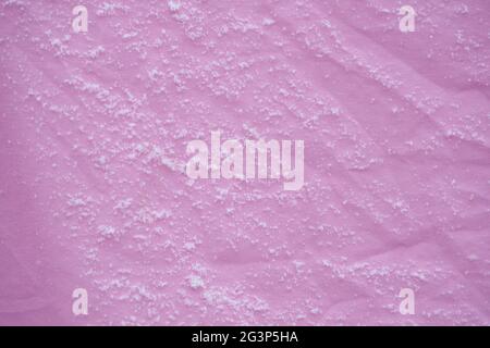 Linen in the cold in winter weather, fresh snow flakes on the texture of the fabric. Stock Photo
