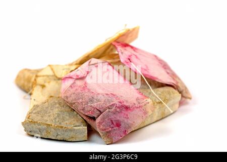 Used tea bags against white background Stock Photo