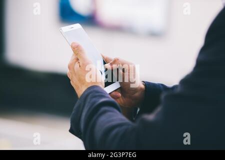 The Guy Is Typing Something On His Cell Phone Close Up Shot Stock Photo